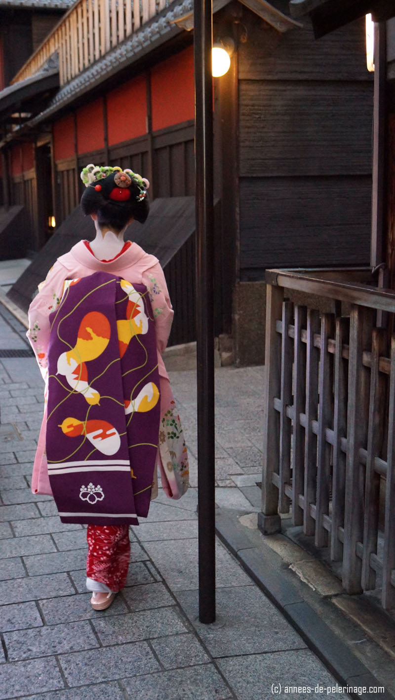 rear view of a geisha (meiko) in hanami lane, gion, kyoto