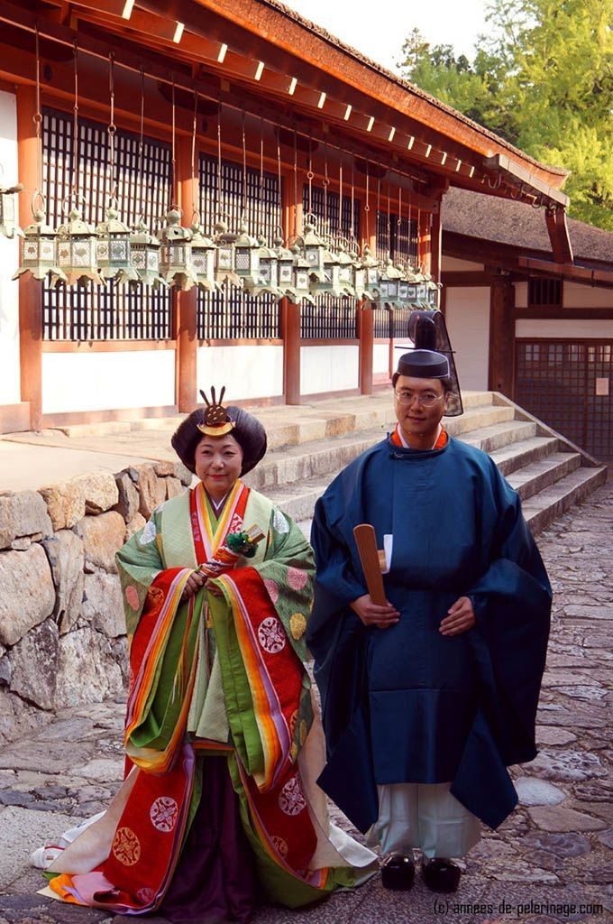 A wedding couple dressed like court nobles (Jūnihitoe) from the nara period in japan seen in Kasuga Taisha