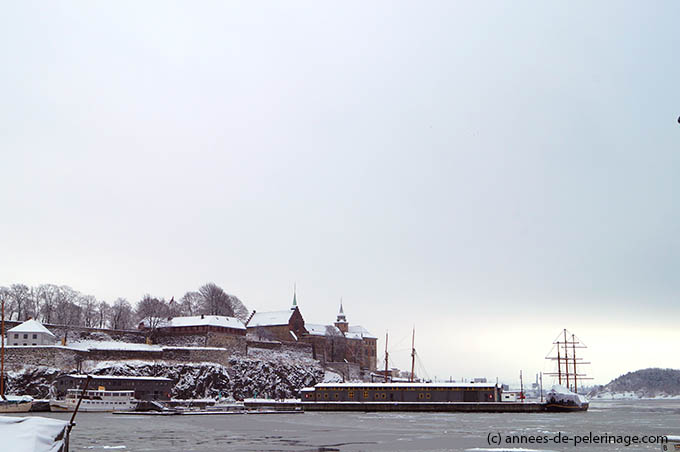 akershus fortress looming over the Harbor of Oslo