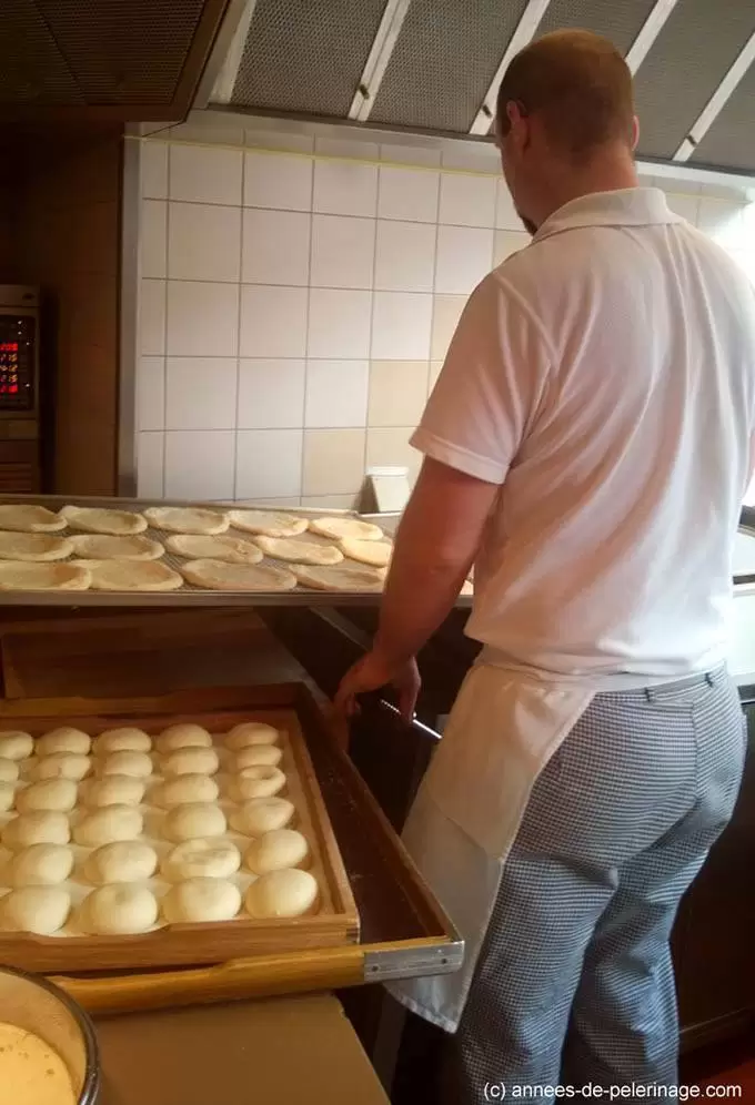 inside cafe frischhut viktualienmarkt - preparing fresh fried dough food