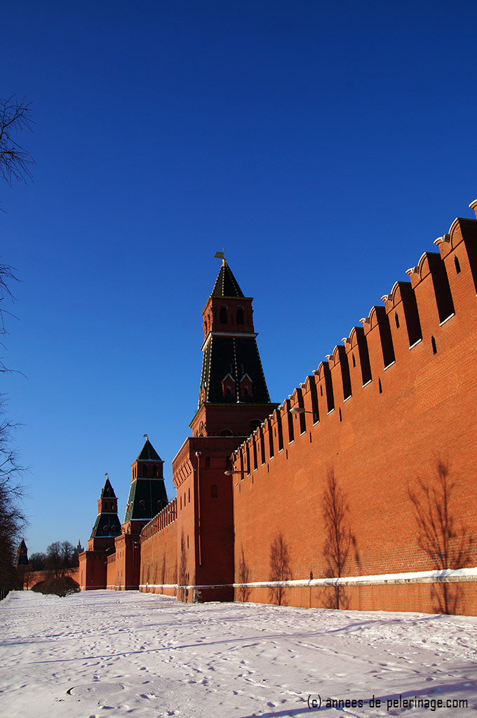 The red walls of the Kremlin seen from the banks of the moscva