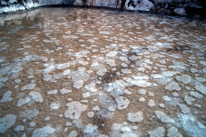 Salt flowers forming on the surface of the evaporation ponds in the Maras salt mines