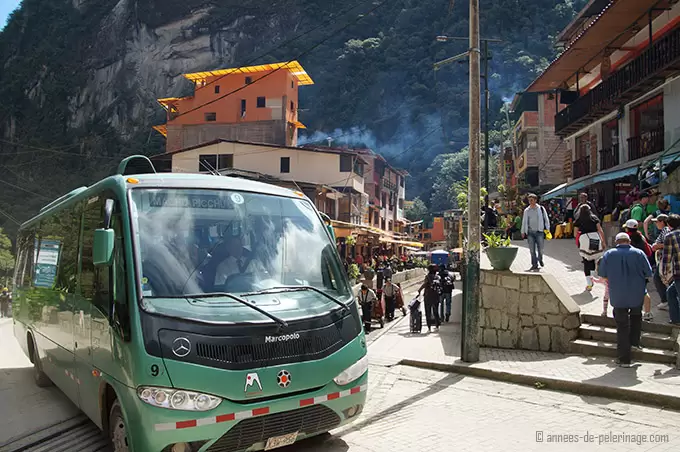 The bus in aquas calientes taking tourists up the road to machu picchu