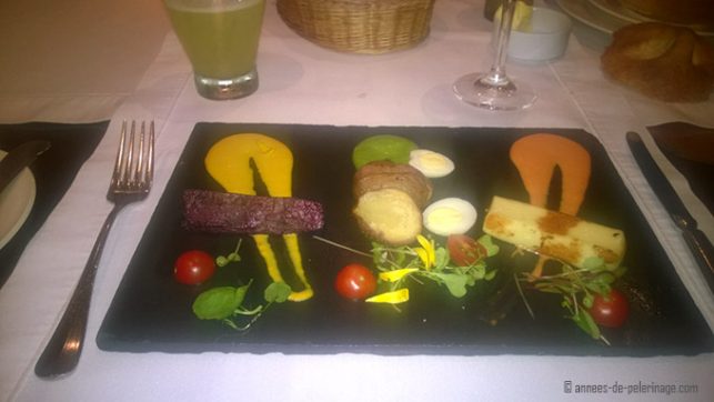 A plate with the starter of the dinner menu at belmond sanctuary lodge