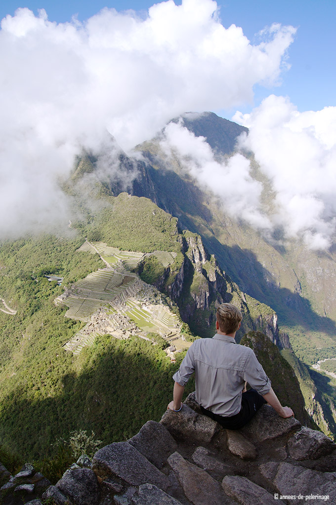 Sitting on a platform near the summit of wayna picchu