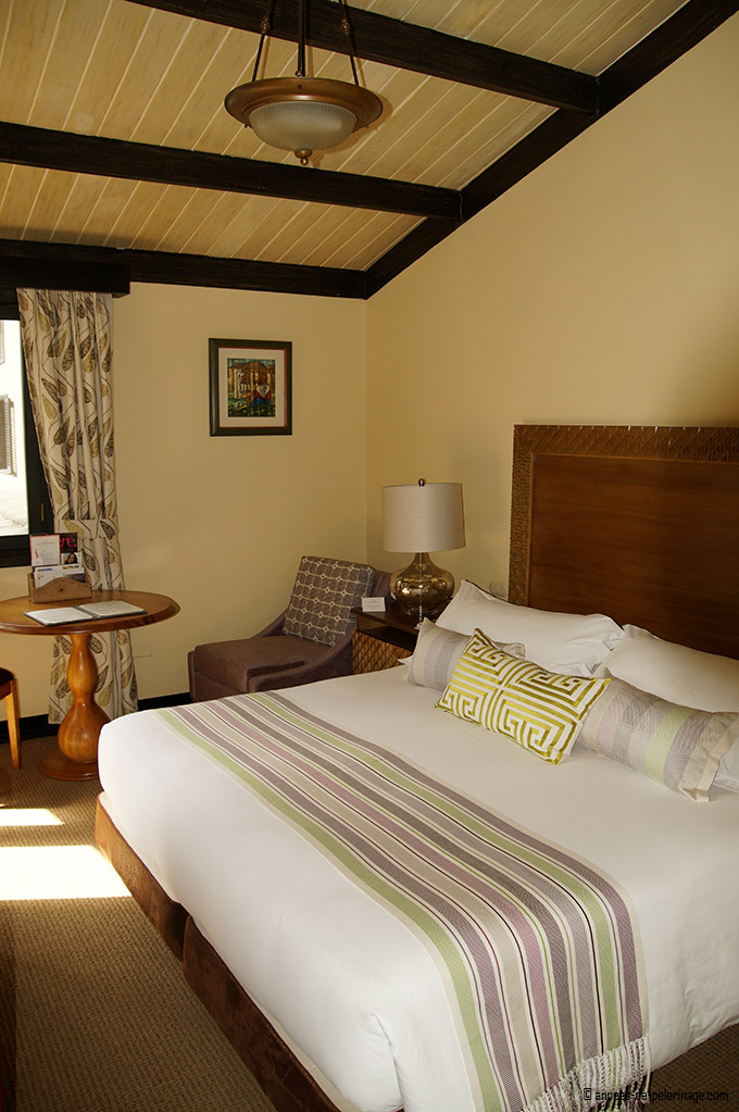 Room with king size bed of the belmond sanctuary lodge in machu picchu