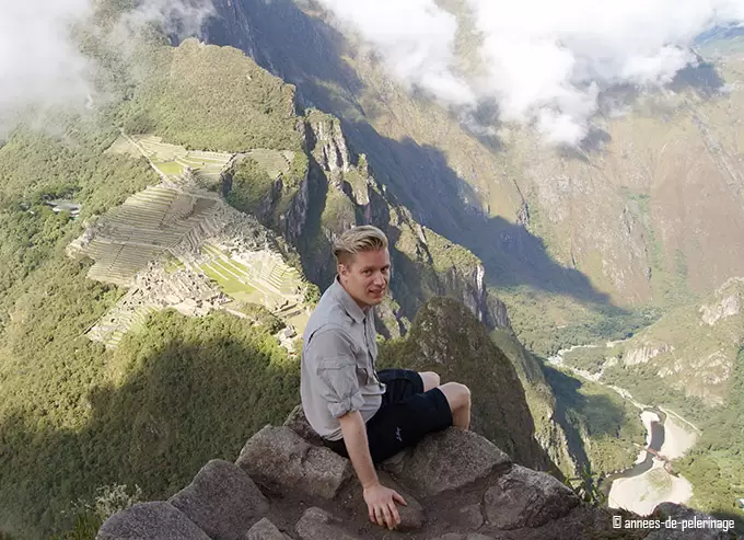 Me sitting on the summit of wayna picchu with machu picchu in the background