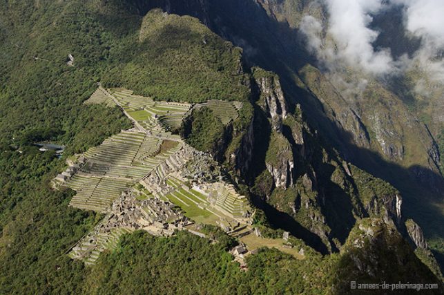 The view on the belmond Sanctuary Lodge and the inca ruins of Machu picchu in general taken from the peak of wayna picchu