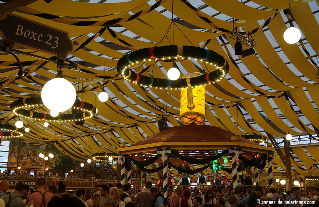 the brass band stage in the middle of a beer tent at oktoberfest