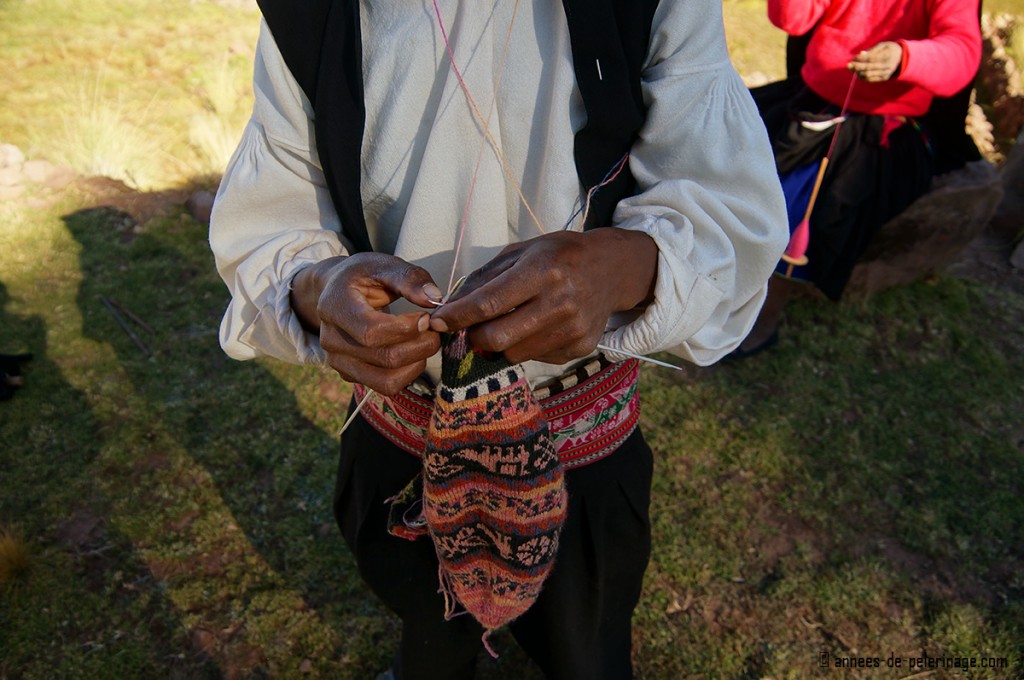 Close-up of the needlework of a male knitter taquile island peru