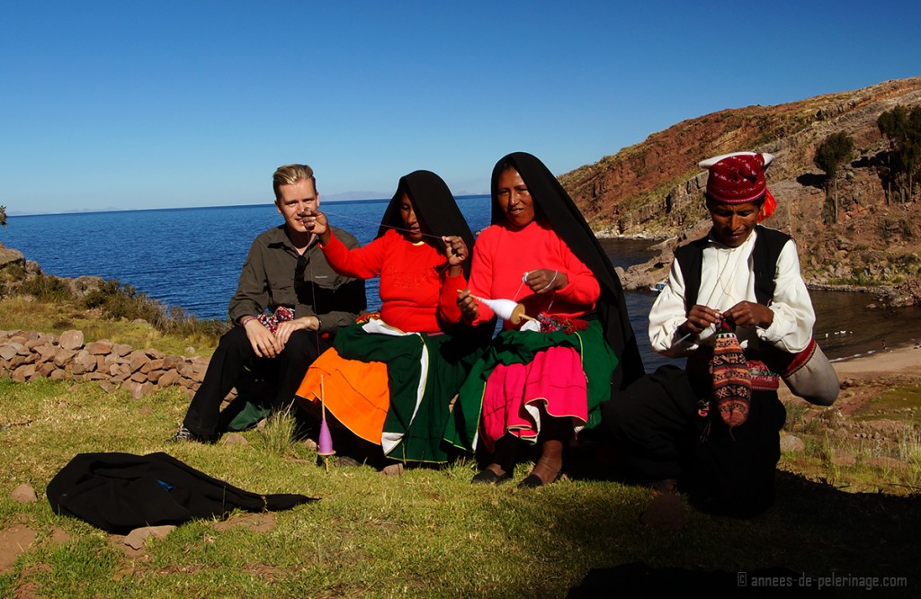 Me sitting with a the knitters and weavers of taquile islands, lake titicaca, peru