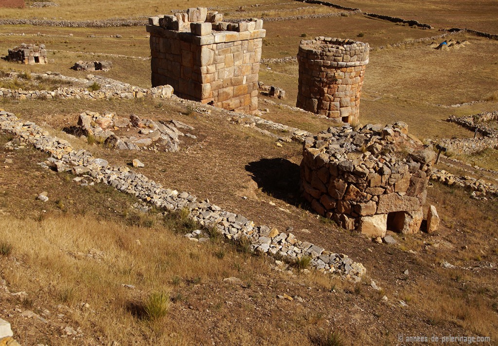 round and square chullpas, some of them in ruins, near lake titicaca peru