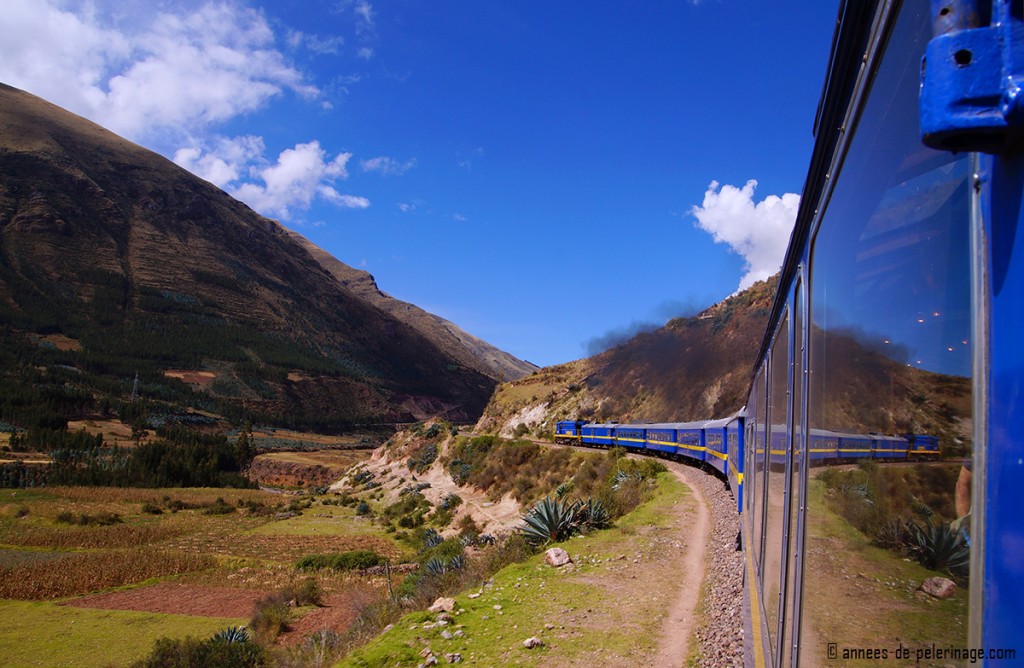 The andean explorer trailing along the mountain side with the beautiful landscape of the altiplano in front of it