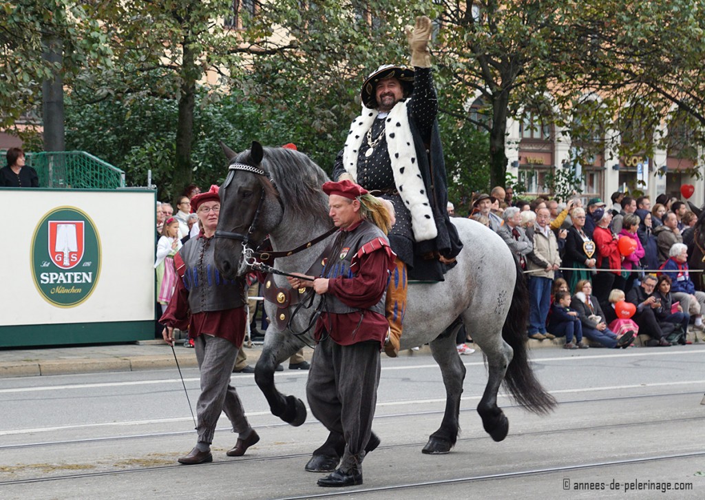 An actor dressed like a bavarian king at the traditional costume parade in munich