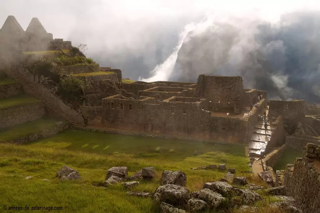 Machu Picchu showing its best side after a heavy rain fall and the sun relfecting in the little puddles