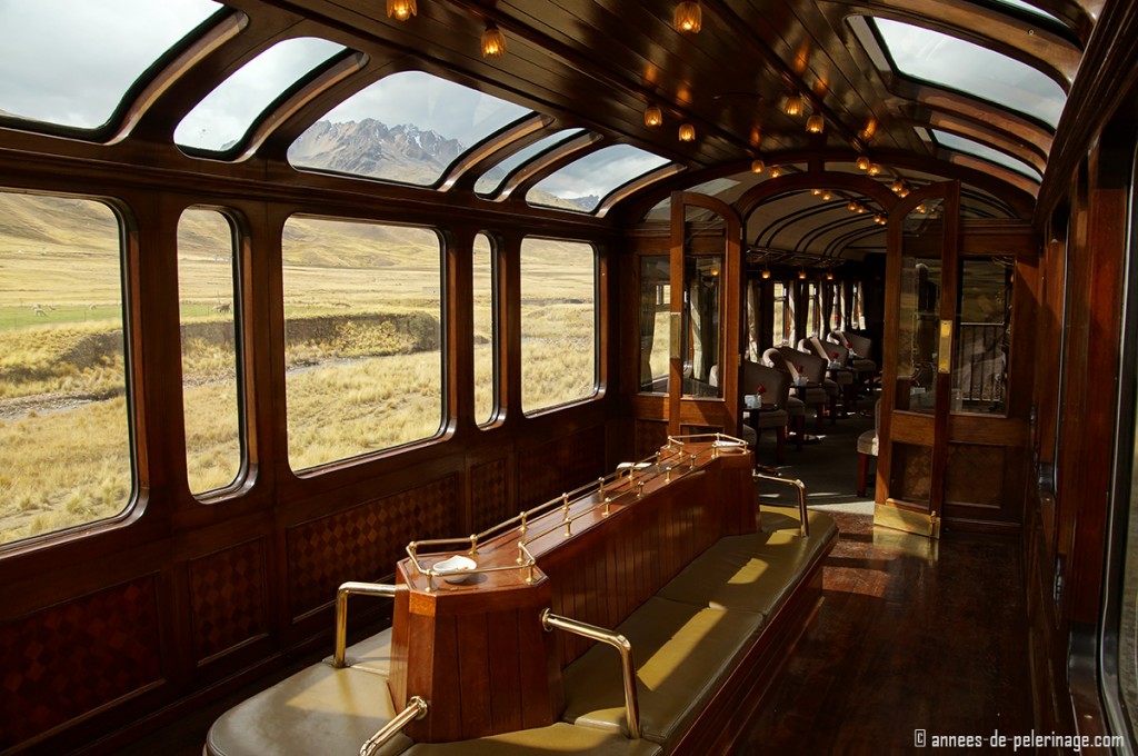 The observation deck of the Andean Explorer luxury train, with the bar visible in the background