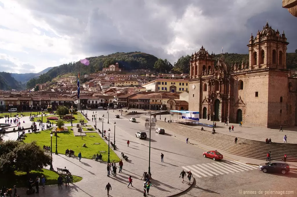 The beautiful Plaza de Armas bathed in golden sunlight in Cusco, Peru