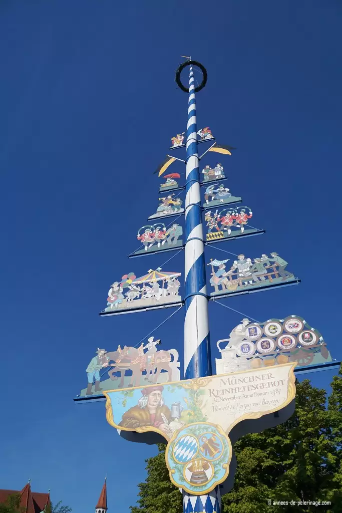 The may pole (Maibaum) standing in the middle of the Viktualienmarkt in Munich