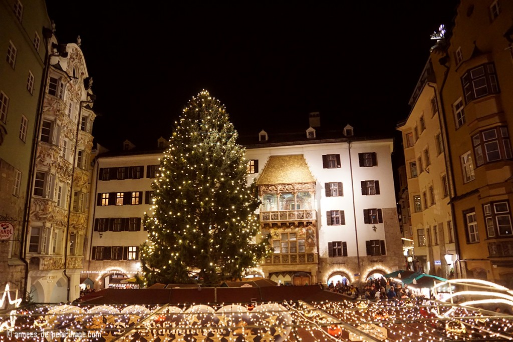 Many lights illuminate the courtyard where the main Christmas Market of Innsbruck is located