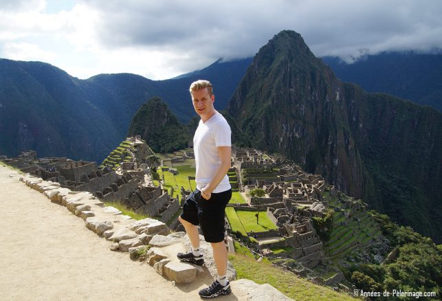 Me and the classic panorama of Machu Picchu. If you are wondering what to pack for peru - think in layers and start at the bottom. On a hot day shorts are perfectly fine in Machu Picchu