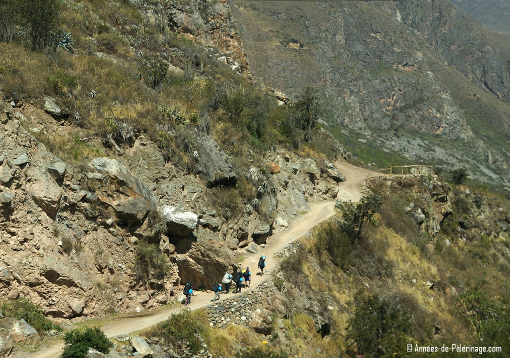 A group of travelers on the Inca Trail on their way to Machu Picchu. Most tours offer you porters, so there is actually no need to pack all that light for the Inca trail
