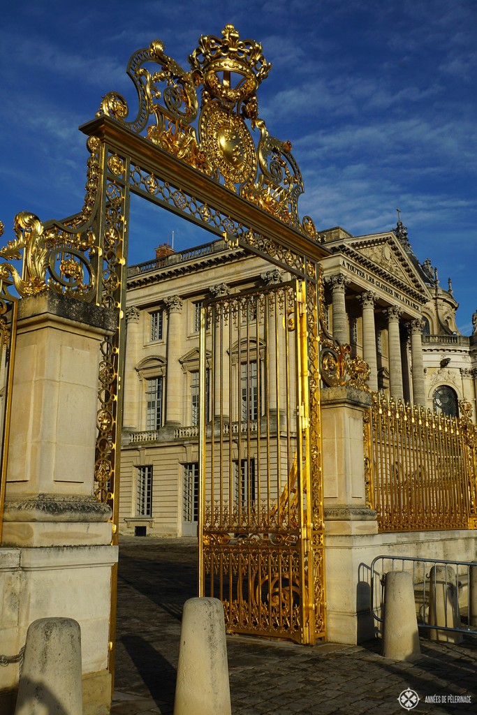 The golden entrance gates of Versailles Castle in Paris