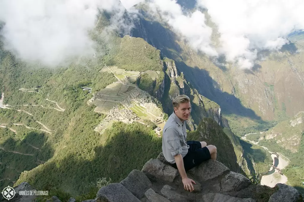A view to die for: Me sitting on top of Huayna Picchu in Peru with a nice view on the inca ruins of Machu Picchu. I survived and did not pay the Huayna Picchu death toll :)