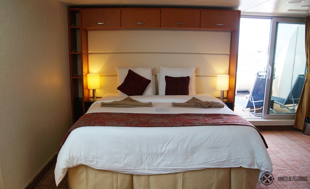 The bed inside the penthouse suite of the Celebrity Xpedition Galapagos luxury cruise ship