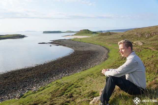 Me sitting at the white coral beach on the Isle of Skye in Scotland. If you are wondering what to pack for Scotland, then know, that you can leave the bathing suit at home.