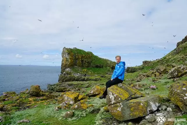 Me wearing a rain jacked in Scotland. Definitely put it on your packing list