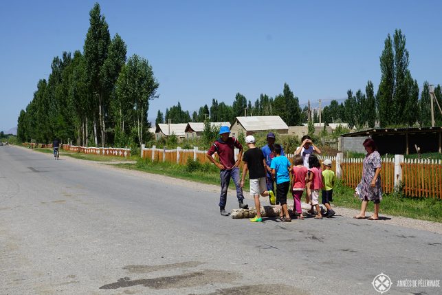 A family making felt on the streets of kyrgyzstan. This is actually the traditional way - rolling it over and over for hours.