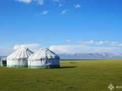 Son-kul lake with two yurts standing near its shore in Kyrgyzstan, just one of many free things to do in Kyrgyzstan, Central Asia