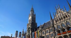 The marienplatz in Munich with its neo-gothic city hall and the frauenkirche in the background