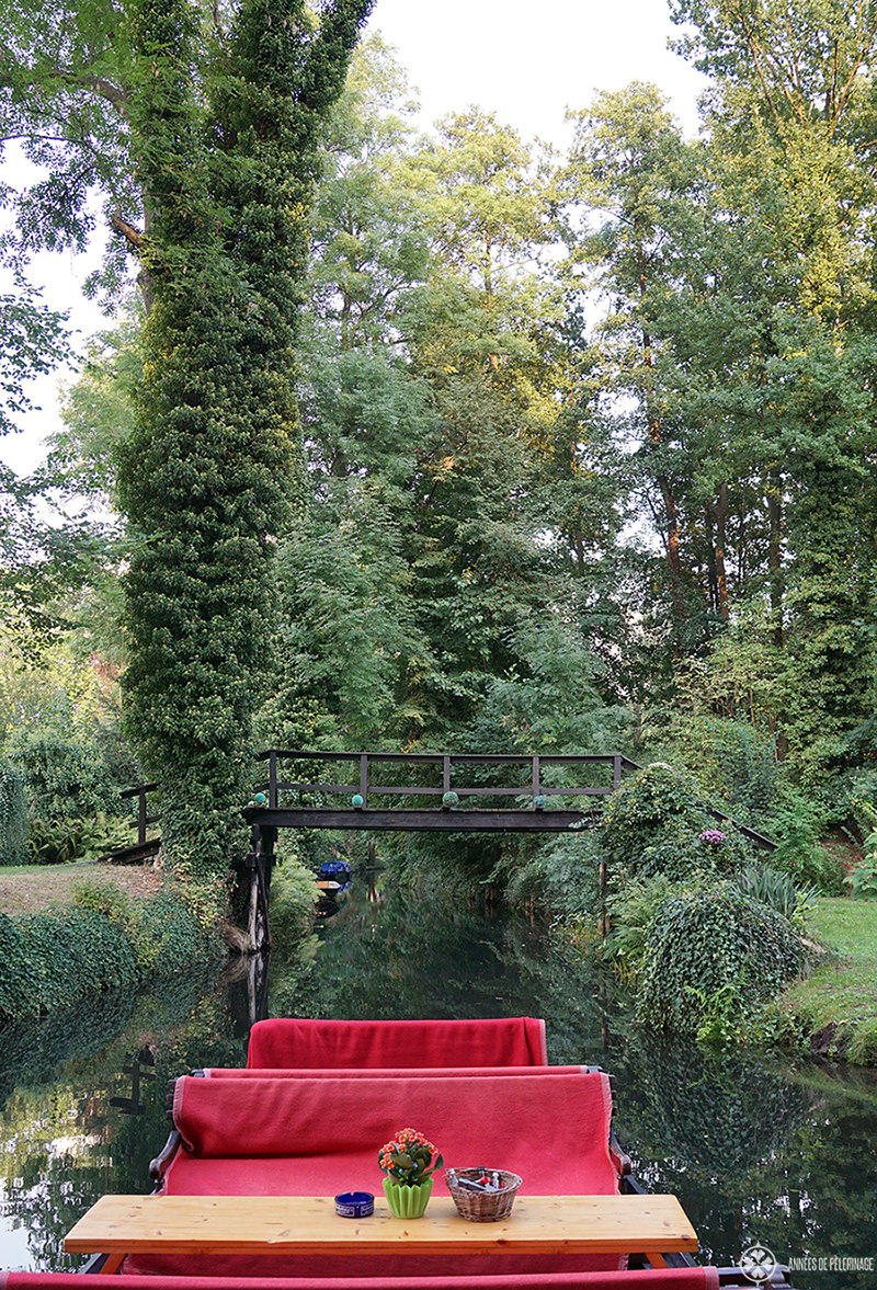 A spreewald boat passing through the many tiny bridges spanning the waterways of the Spree river