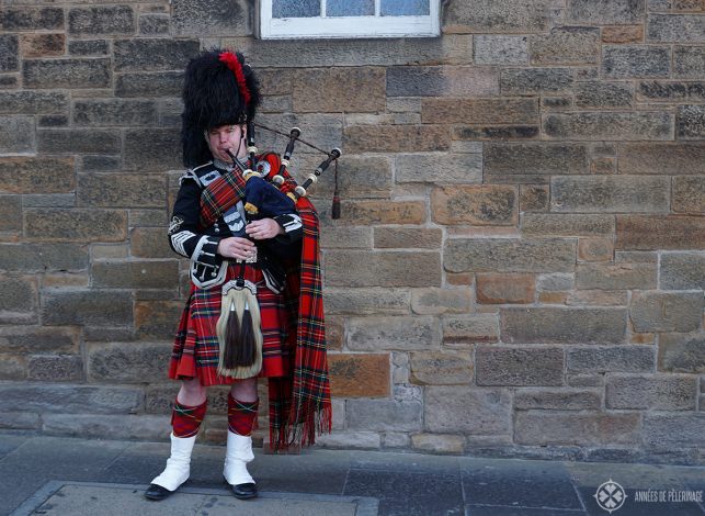 a bag pipe player on the Royal Mile in Edinburgh Scotland