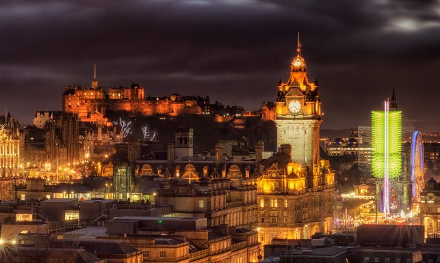 The clock tower of the Balmoral Luxury hotel in Edinburgh at night