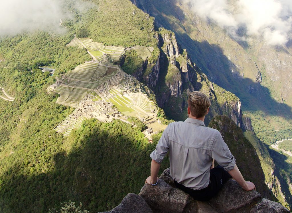 Me sitting ontop of the ruins after a long day from Cusco to Machu Picchu