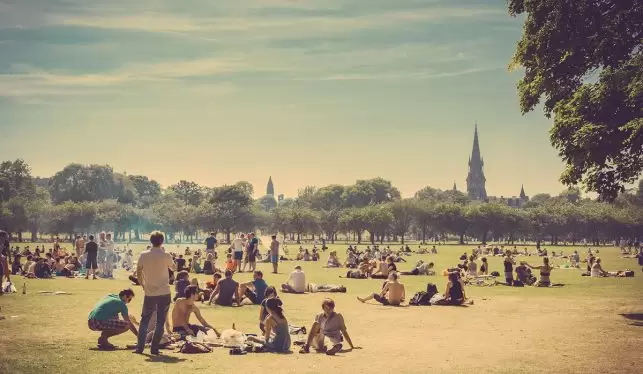 Locals enjoying the sun at the Meadows garden in Edinburgh