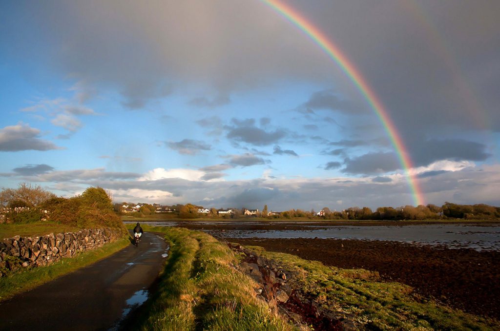 Rainbow over Mweeloon Bay, Ireland. If you plan to take a bike tour, you really should bring a poncho, as you can see.