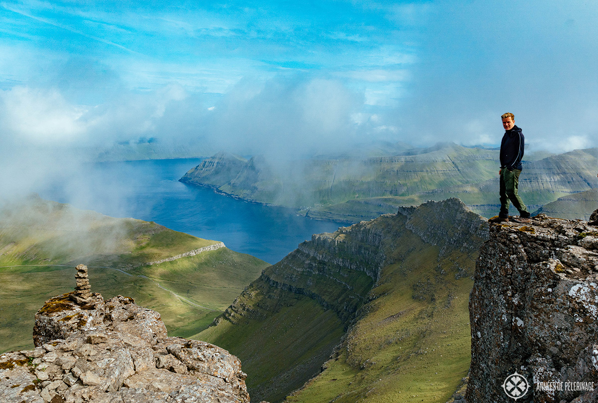 Me standing at the top of the Slættaratindur - one of the best hikes in the Faroe Islands