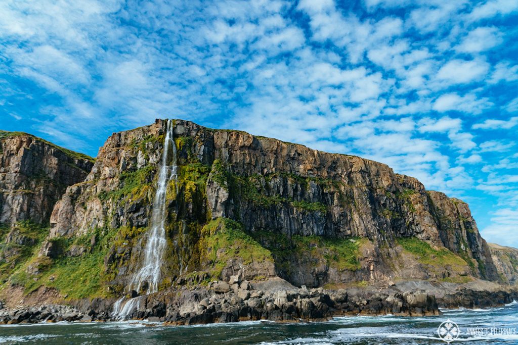 A secret waterfall dropping right into Ocean in Iceland