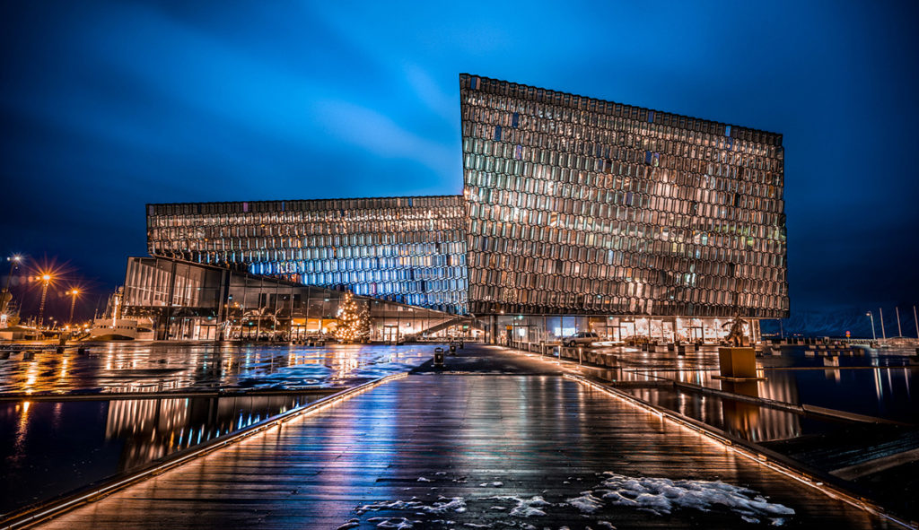 harpa concert hall at night, right near the harbor of Reykjavik