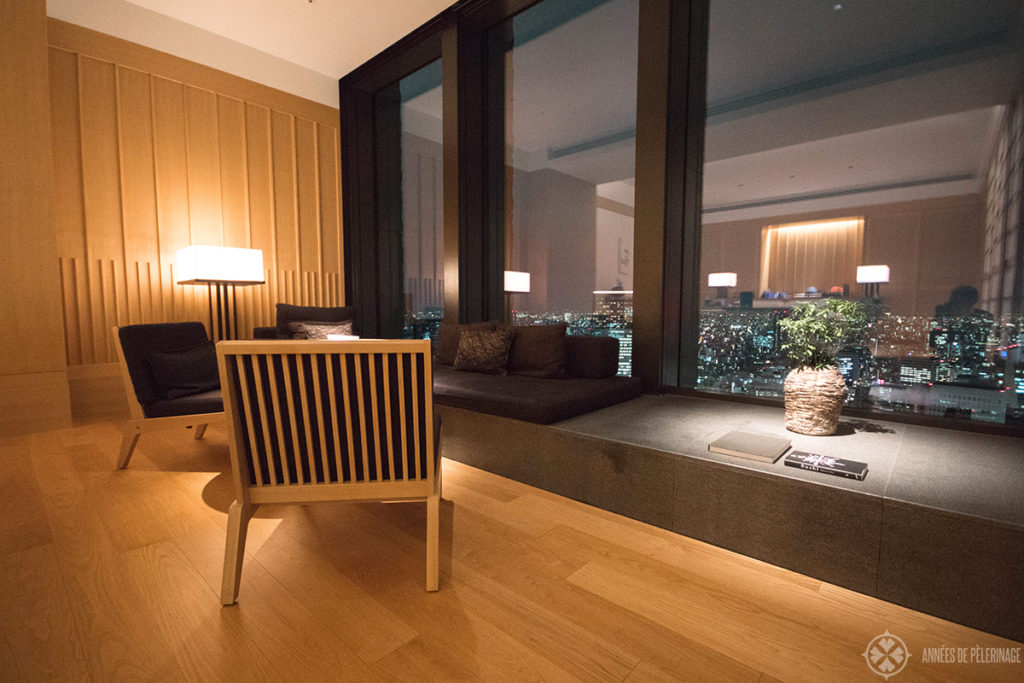 THe sitting area of the premier room at the Aman Tokyo at night