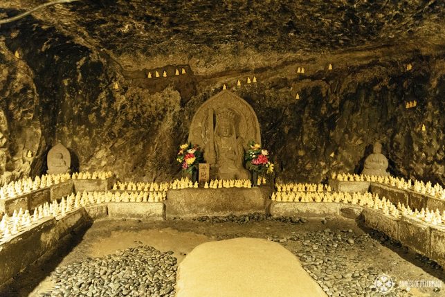 A cave at Hase-Dera temple with a statue of the goddess Benzaiten in Kamakura, Japan