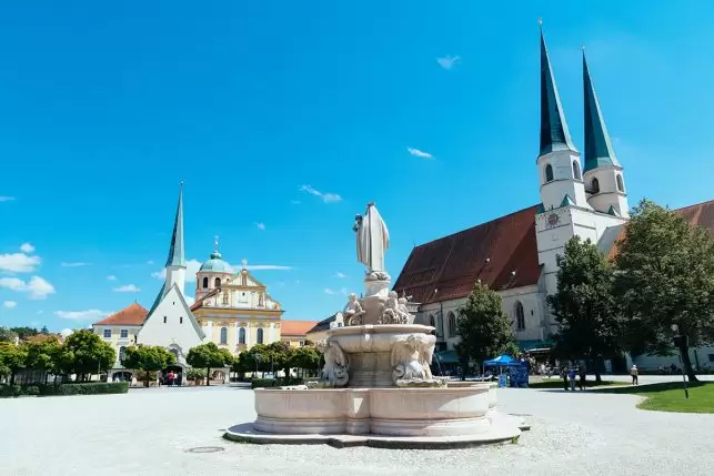Central chapel square with a fountain in the foreground in Altöttingen, Germany