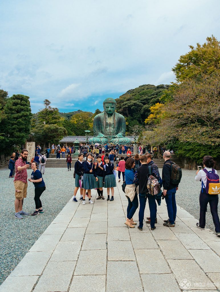 the paved stone path leading to the Kamakura Daibutsu at kotoku-in temple in Japan
