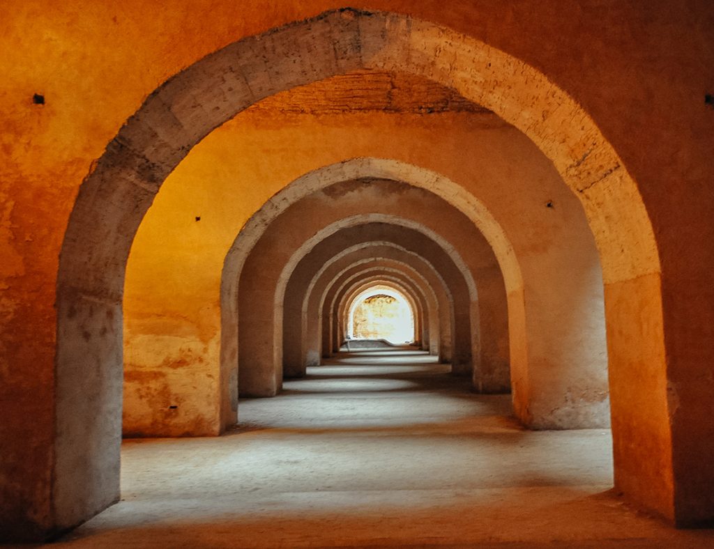 Inside the corridors of the Habs Qara - one of the many unique things to do in Meknes, Morocco