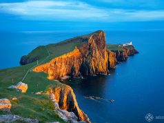 Sunset at the Neist Point Lighthouse with deep red cliffs on the Isle of Syke, Scotland