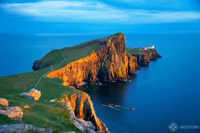 Sunset at the Neist Point Lighthouse with deep red cliffs on the Isle of Syke, Scotland