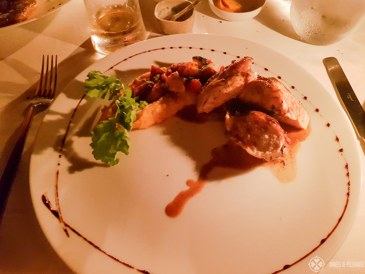 A typical western style main course (think it was mediterraneanchicken) at the main restaurant of Amanwella